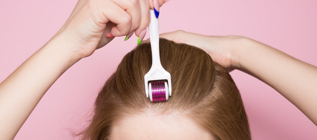 A woman uses a dermaroller on her scalp as part of a home mesotherapy treatment.