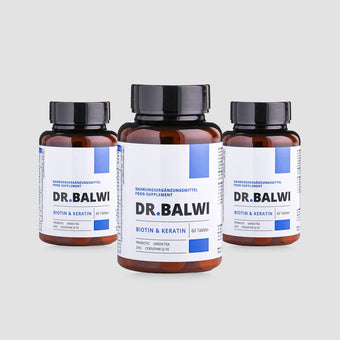 Three brown bottles of Biotin & Keratin tablets with white and blue labels, 60 tablets each, on a light grey background.