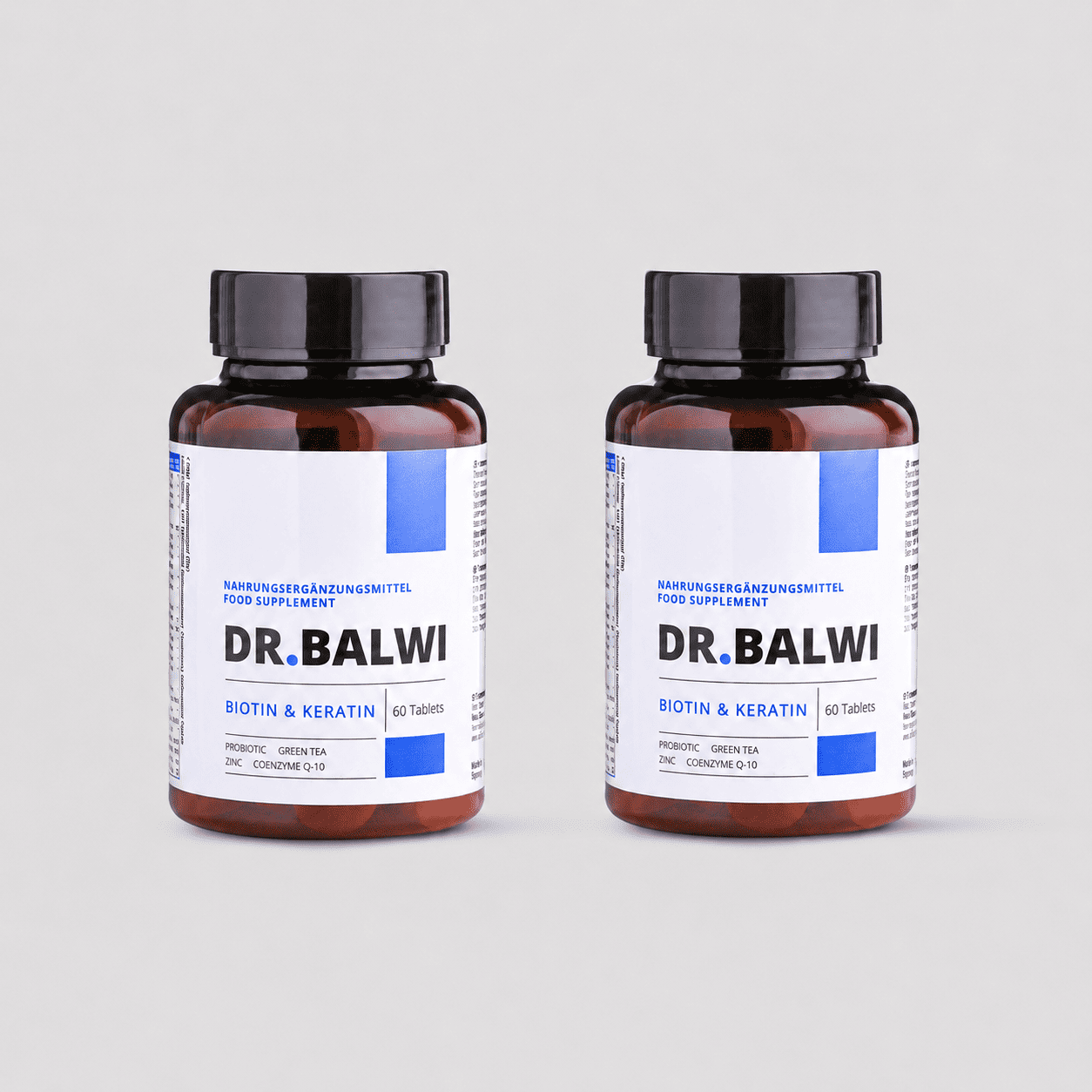 Zwei braune Flaschen Dr. Balwi Shop Biotin & Keratin Tabletten mit je 60 Tabletten stehen nebeneinander auf einem hellgrauen Hintergrund zur Unterstützung von Haarwachstum und gesundem Haar.